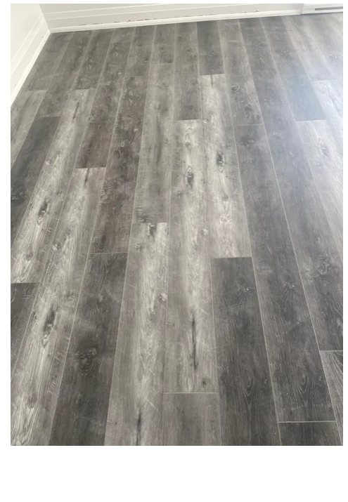 New vinyl plank flooring installed in a restored interior